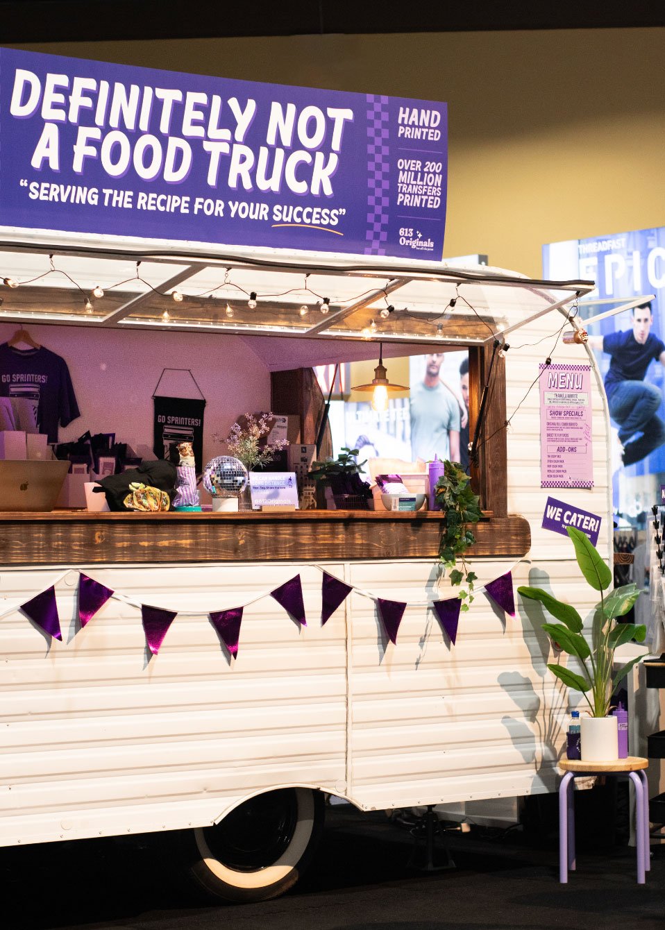 A look at our finished booth. A truck with decoration and a sign that says "Definitely not a food truck."