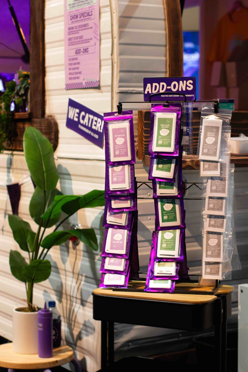 A close up image of our swatch pack stand made to look like hot sauce packets.